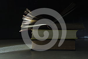 Open book on a stack of books, reading, education, education concept,  free copy space