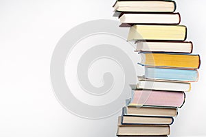 Open book, stacking, hardback books on wooden table and background. Back to school. Copy space for text,