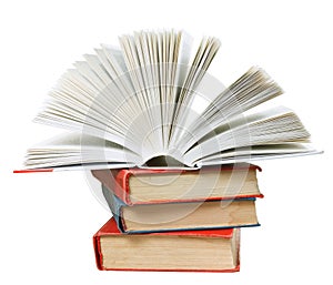 Open book on top of stack of books