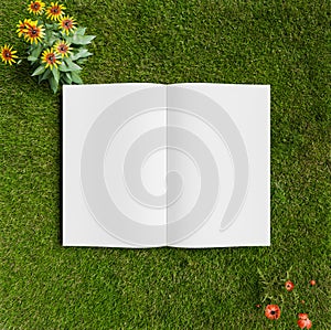 Open book on top view grass field, white book mock up design