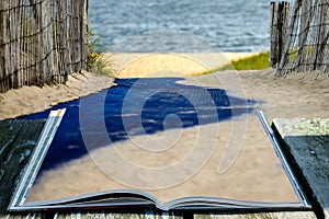 Open book with walkway to beach and wooden fence