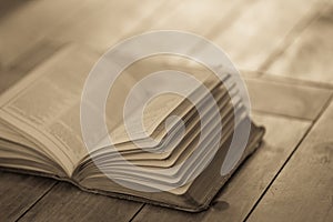 Open book on wooden table