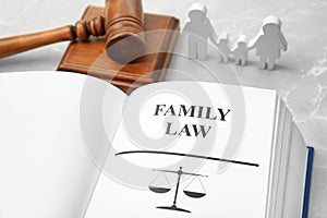 Open book with words FAMILY LAW and gavel on table