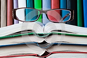 On open books lie glasses concept