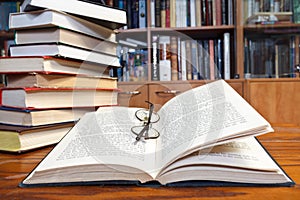 Open books on wooden table