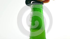 Open a bottle of beer,beer foam flows through the bottle,close-up,on a white background.