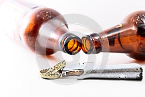 Open bottle neck and bottle lid cap and opener isolated on white background. human Beer alcoholism concept