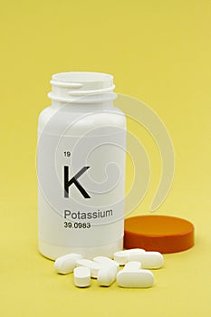Open bottle of Potassium vitamins photo