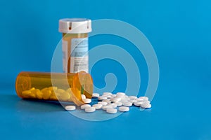 Opioid Crisis - Open Bottle of Prescription Painkillers. Medicare, overdose.