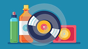 An open bottle of record cleaning fluid sits next to a stack of vinyl records ready to be used for a thorough preplay