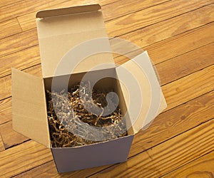 Open box with packing paper shreds