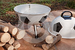 Open brazier in form of soccer ball stands in yard
