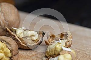 Open and broken walnut shells lying on the table