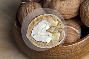 Open and broken walnut shells lying on the table