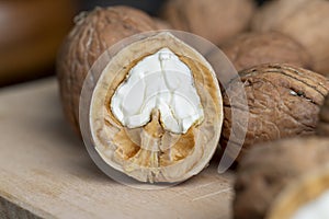 Open and broken walnut shells lying on the table