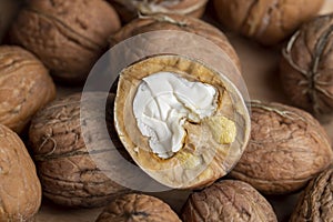 Open and broken walnut shells lying on the table