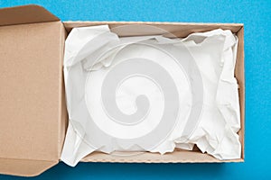 Open brown cardboard box, shipping package