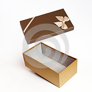 Open brown gift box on white background