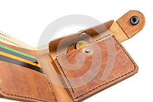Open brown mens wallet with money and credit cards