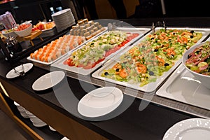 Open buffet self-service, catering business, trays of food, salad, sushi