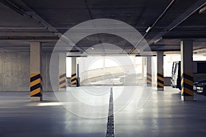 Open car parking garage with ramp on sunny day