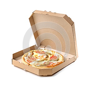 Open cardboard box with delicious pizza on white background.
