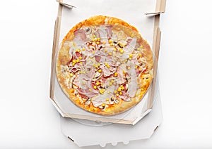 Open cardboard box with hot pizza on white background