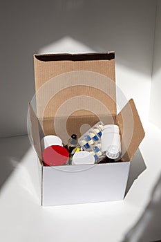 Open cardboard box of medicines as a pharmacy delivery.