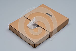 Open cardboard box with plastic bag inside ready for packaging