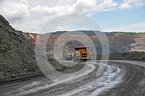 Open cast mine under dramatic sky