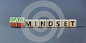 Open or closed mindset symbol. Turned wooden cubes and changed concept words closed mindset to open mindset. Beautiful grey
