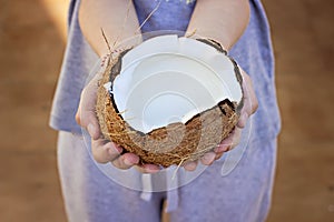 Open coconut in hands