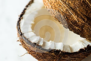 Open coconut on white