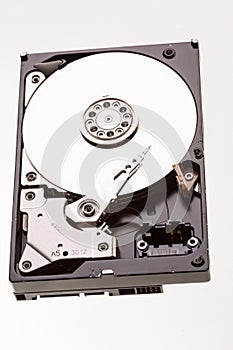 Open computer hard drive disc on white