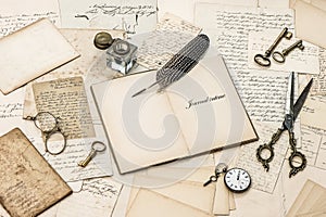 Open diary notebook, old letters and postcards