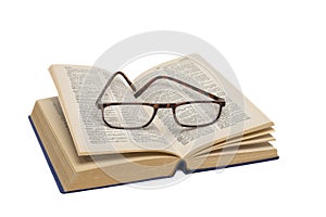 Open dictionary with glasses on white background.