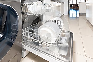 Open dishwasher with clean dishes