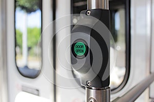 Open the door. Green button for opening doors in the subway and bus. Button to stop transport.