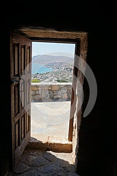 Open door of the medieval church of Prophet Elias in Pefkos or Pefki, Rhodes island, Greece