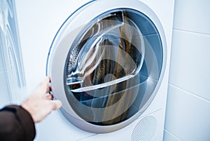 Open door of a modern new front-load clothes dryer