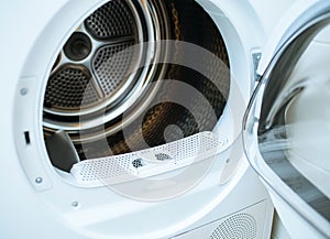 Open door of a modern new front-load clothes dryer