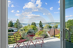 Open door to a balcony with beautiful Lake Washington view