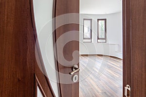 Open door to a empty room. Interior. Welcome, to new home concept