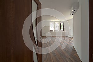 Open door to a empty room. Interior. Welcome, to new home concept