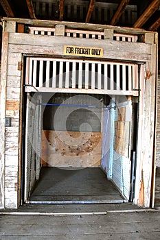 Open door to an old freight elevator