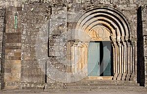 Open door to old stone church. Archway to medieval cathedral. Romanesque architecture concept. Religion and faith concept.