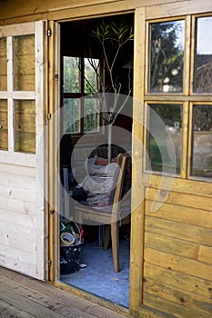 Open door into a wooden storage shed