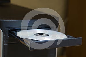 Open dvd rom on computer closeup with disk