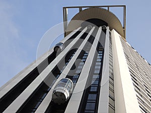 Open elevator reaching sky