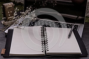 Open empty blank notebook organizer with pen for planning work on laptop. Concept for business, Planning or diary. Great for any